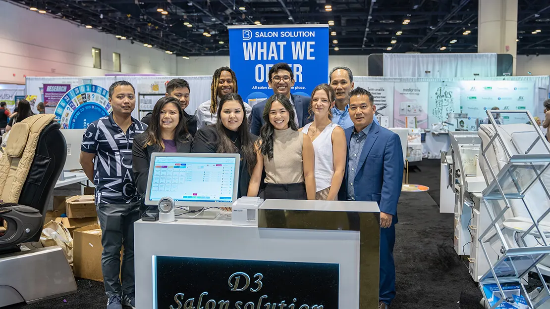 The D3 Salon Solution team at a trade show booth